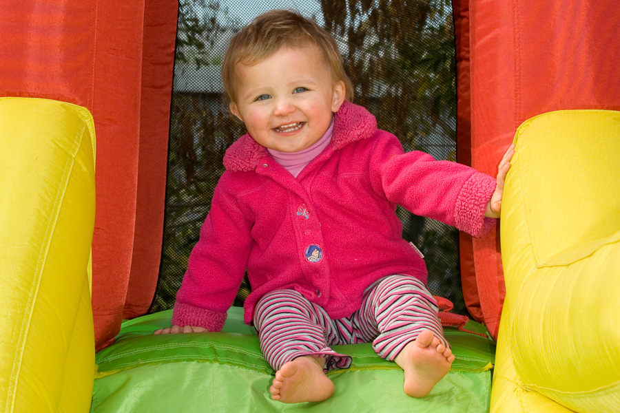 Photo of toddler playing on a jumping castle