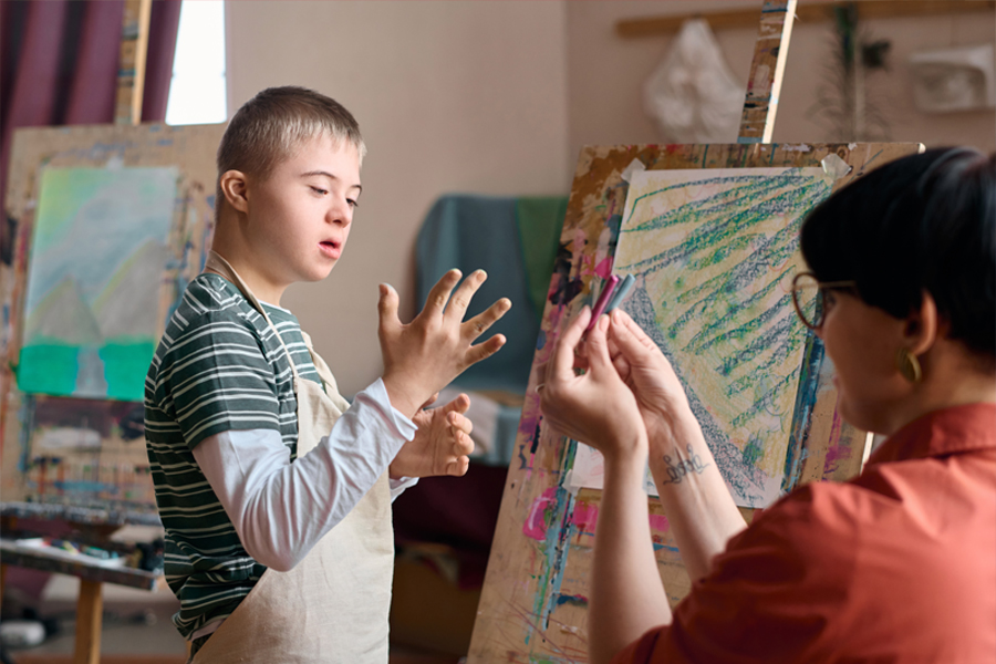boy with down syndrome choosing paint colors